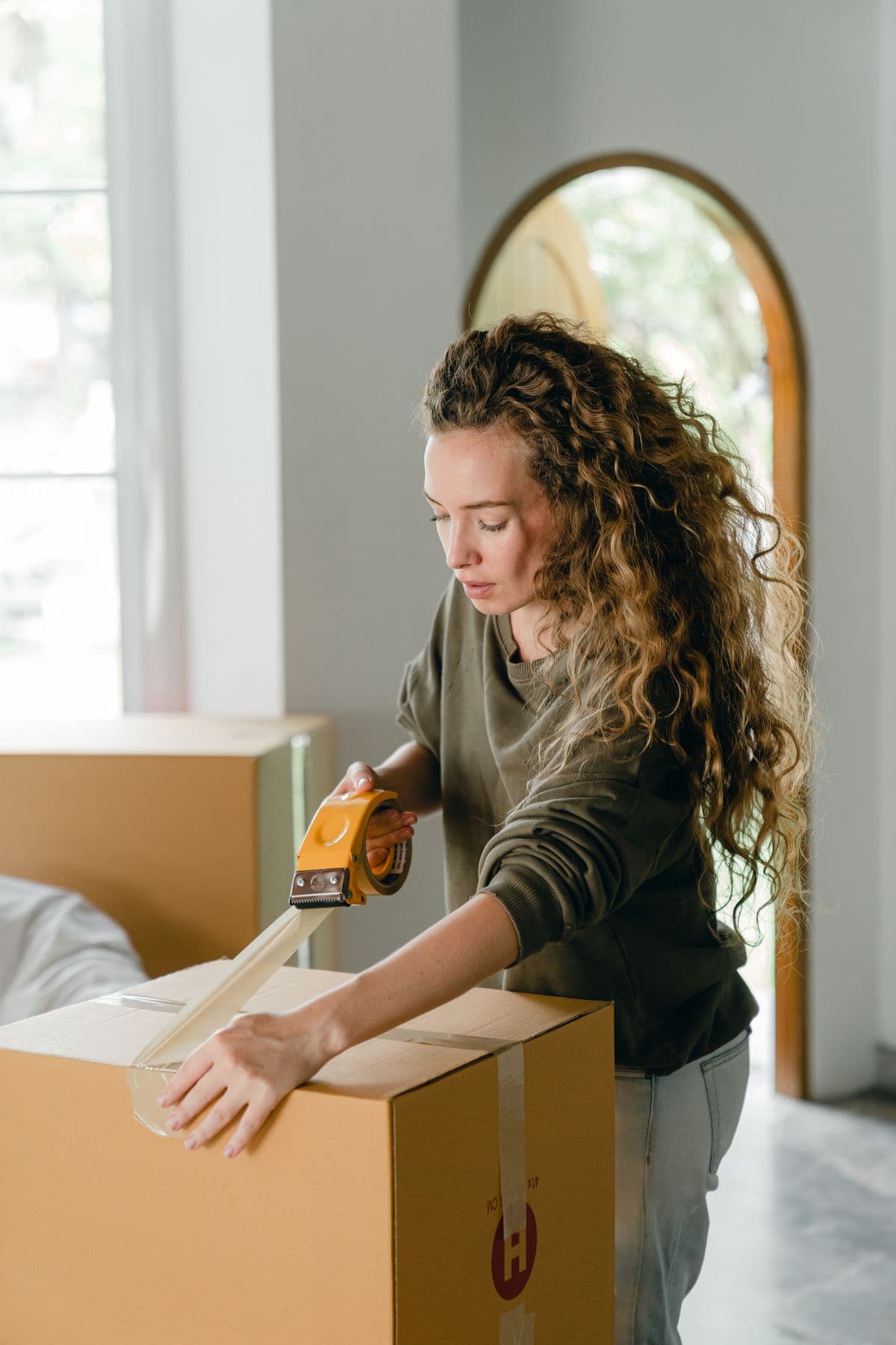 Moving team professionally packing items